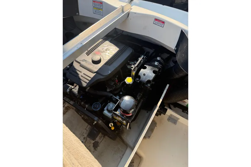 Slide: The Image of Engine compartment of a 2006 Sea Ray 195 Sport boat, showcasing detailed components. - 10