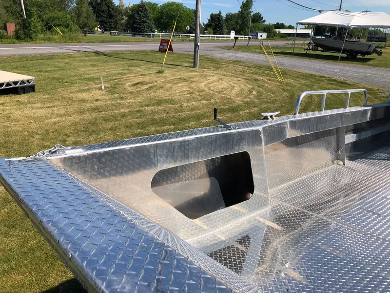 Slide: The Image of A sturdy workboat with an aluminum deck, ideal for shallow water operations. - 7
