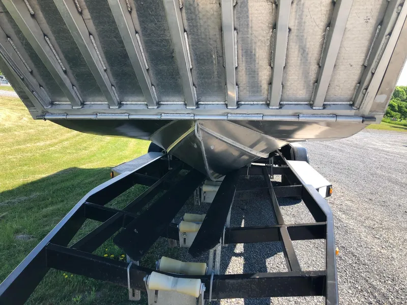 Slide: The Image of An aluminum landing craft on a trailer, ready for transport. - 5