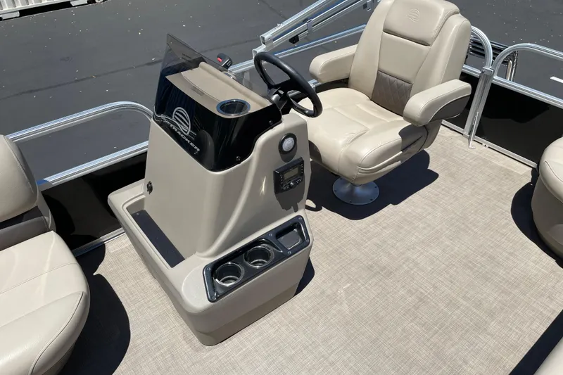 Slide: The Image of 2025 Sun Tracker Party Barge 16 DLX interior with helm and seating. - 9