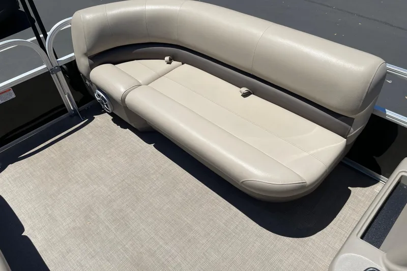 Slide: The Image of 2025 Sun Tracker Party Barge 16 DLX pontoon boat with beige seating and spacious deck. - 7