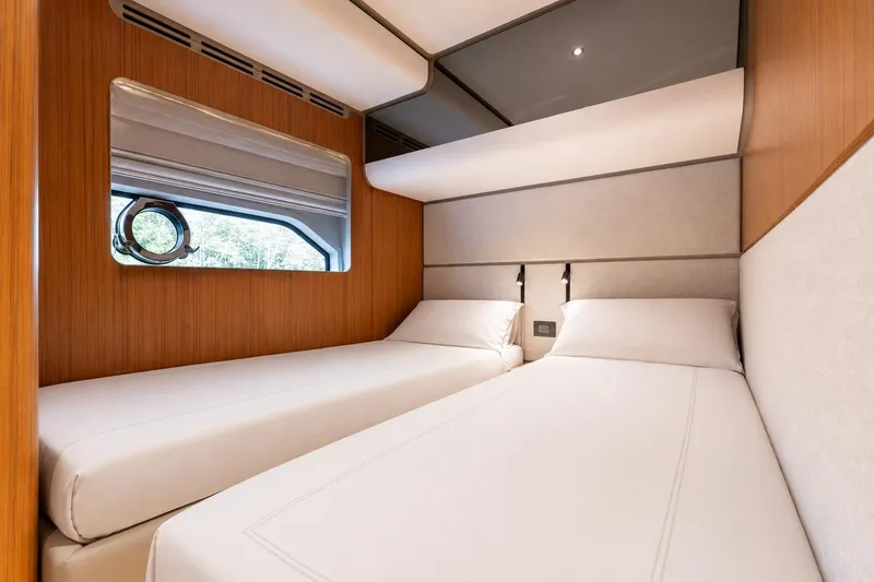Slide: The Image of Luxurious twin cabin interior of 2025 Ferretti Yachts 670, featuring modern design and comfort. - 22