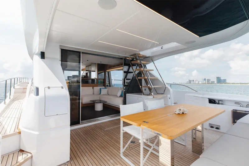 Slide: The Image of Luxurious 2025 Ferretti Yachts 670 deck with elegant seating and ocean view. - 4