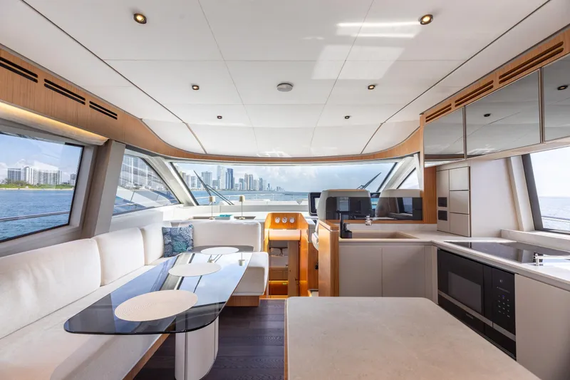 Slide: The Image of Luxurious interior of 2025 Ferretti Yachts 670 with modern kitchen and panoramic windows. - 10