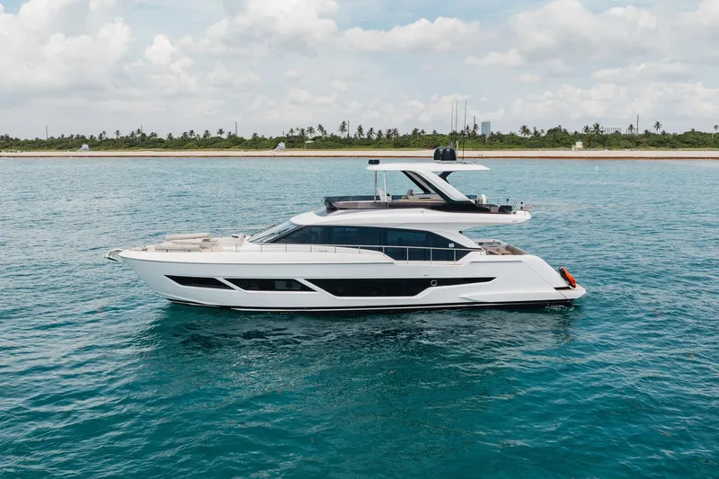 Slide: The Image of Luxury 2025 Ferretti Yachts 670 cruising on serene blue waters. - 40