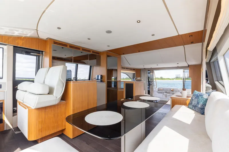 Slide: The Image of Luxurious interior of 2025 Ferretti Yachts 670 with modern furnishings and scenic views. - 12