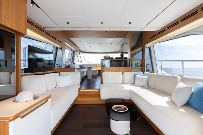 Slide: The Image of Luxurious interior of 2025 Ferretti Yachts 670 with elegant seating and panoramic windows. - 6