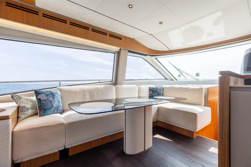 Slide: The Image of Luxurious interior of 2025 Ferretti Yachts 670 with elegant seating and panoramic windows. - 9