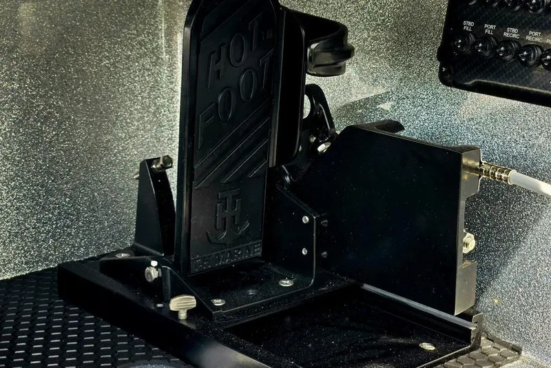 Slide: The Image of Foot pedal assembly in a 2027 Phoenix 721 ZXL boat cockpit. - 34