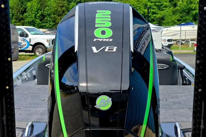 Slide: The Image of 2027 Phoenix 721 ZXL boat with Mercury 250 Pro V8 engine, parked outdoors. - 6