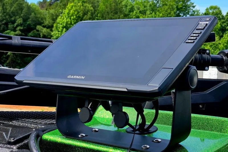 Slide: The Image of Garmin display on 2027 Phoenix 721 ZXL boat, surrounded by lush greenery. - 25