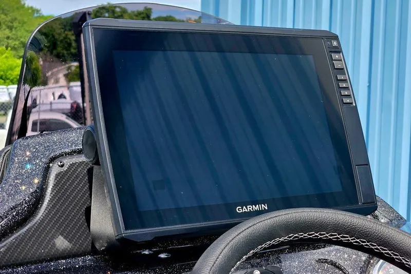 Slide: The Image of Garmin display on 2027 Phoenix 721 ZXL boat dashboard, with carbon fiber accents. - 43