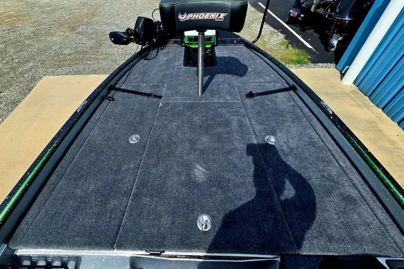 Slide: The Image of 2027 Phoenix 721 ZXL boat deck with carpeted surface and fishing seat. - 29