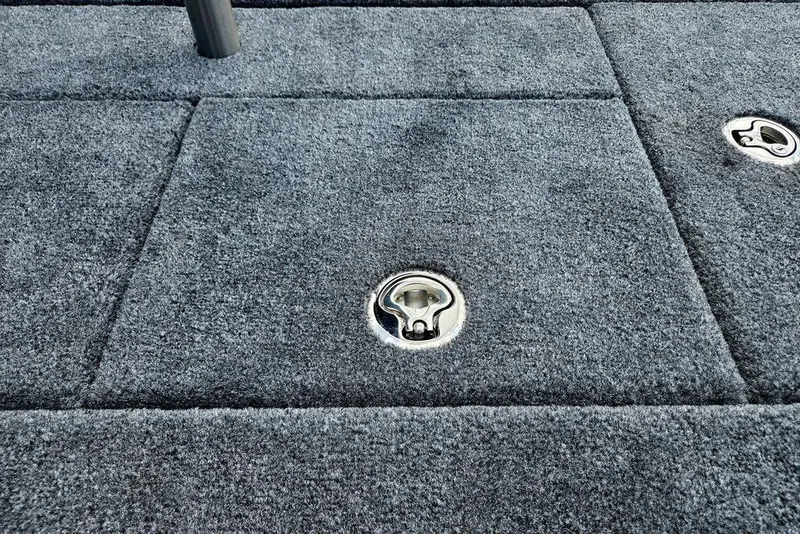 Slide: The Image of Carpeted deck of 2027 Phoenix 721 ZXL boat with metal latches. - 78