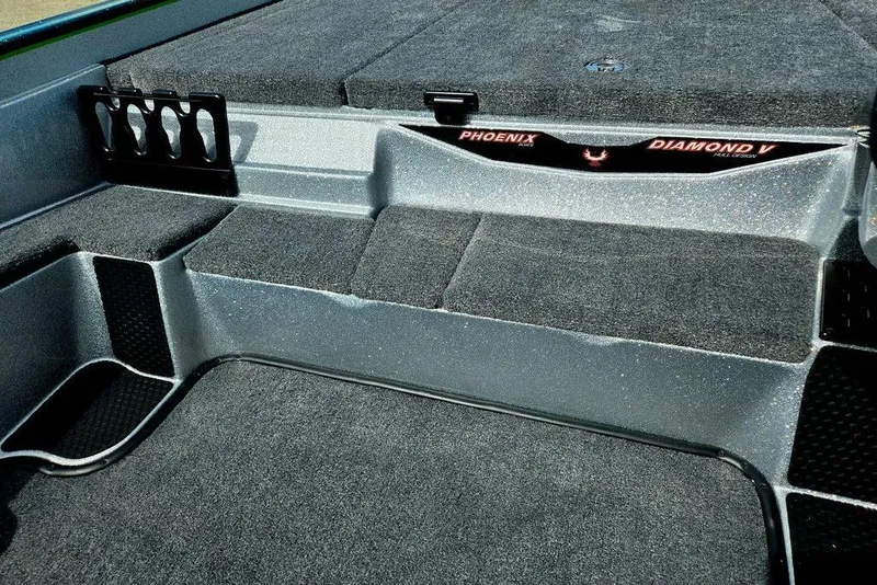 Slide: The Image of 2027 Phoenix 721 ZXL boat interior with carpeted deck and rod holders. - 32