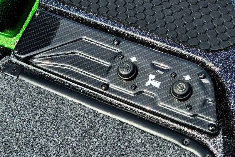 Slide: The Image of Carbon fiber control panel on 2027 Phoenix 721 ZXL boat with trim buttons. - 22