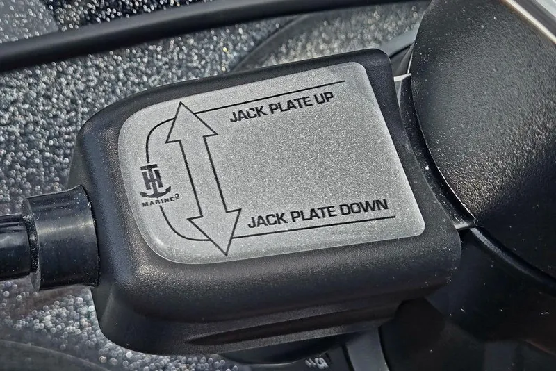 Slide: The Image of Close-up of a 2027 Phoenix 721 ZXL jack plate control switch. - 51