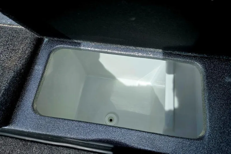 Slide: The Image of Open storage compartment in 2027 Phoenix 721 ZXL boat, featuring a clean, spacious interior. - 33