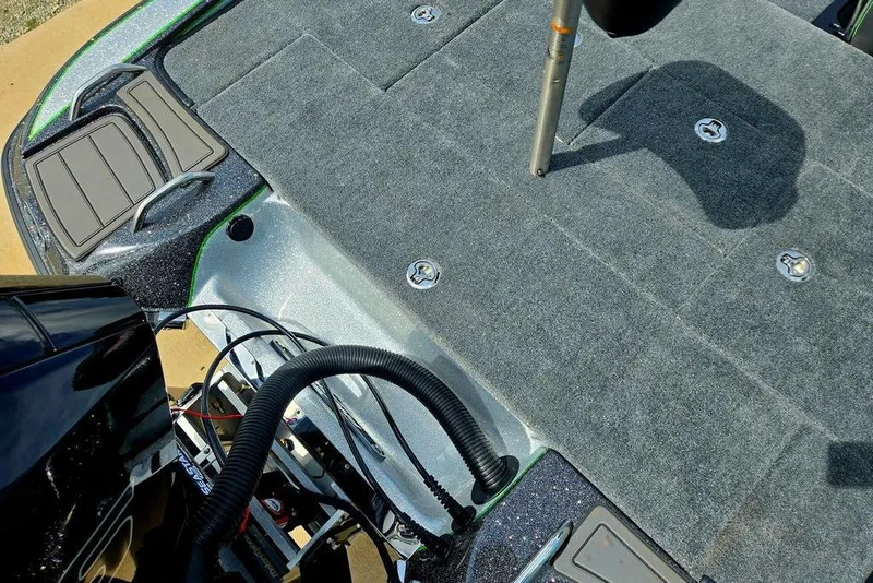 Slide: The Image of 2027 Phoenix 721 ZXL boat deck with carpeted surface and storage compartments. - 60