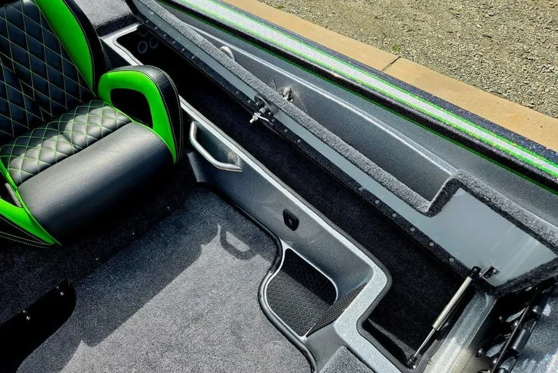 Slide: The Image of Interior of 2027 Phoenix 721 ZXL boat with green and black seating. - 37