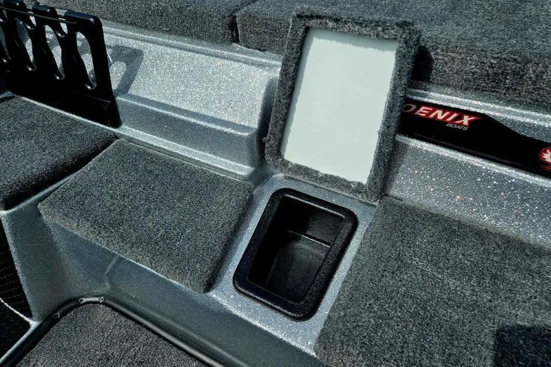Slide: The Image of Interior of 2027 Phoenix 721 ZXL boat with carpeted surfaces and storage compartments. - 71