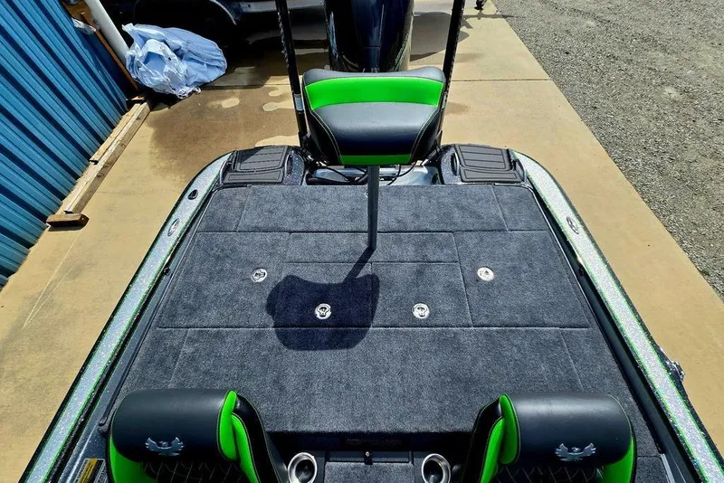 Slide: The Image of 2027 Phoenix 721 ZXL boat deck with green accents and seating. - 55