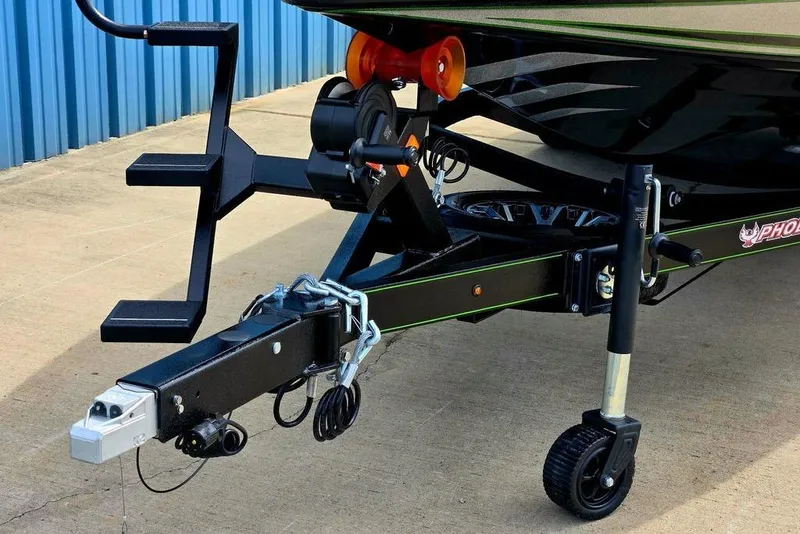 Slide: The Image of Trailer hitch of a 2027 Phoenix 721 ZXL boat, featuring sturdy construction and secure attachments. - 11