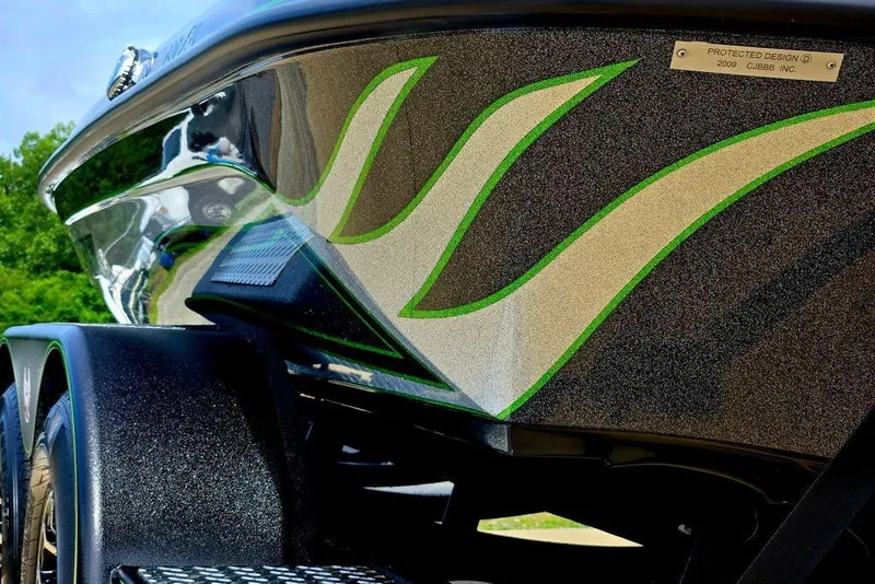 Slide: The Image of Close-up of 2027 Phoenix 721 ZXL boat with sleek green and white design. - 10