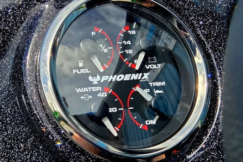 Slide: The Image of Dashboard gauges of 2027 Phoenix 721 ZXL boat, showing fuel, voltage, and water levels. - 45