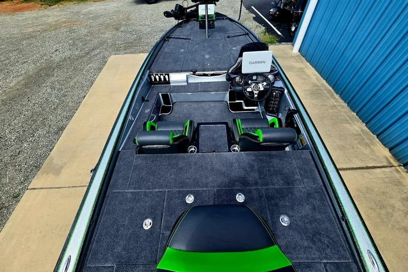 Slide: The Image of 2027 Phoenix 721 ZXL boat interior with Garmin system, featuring sleek seating and spacious deck. - 64
