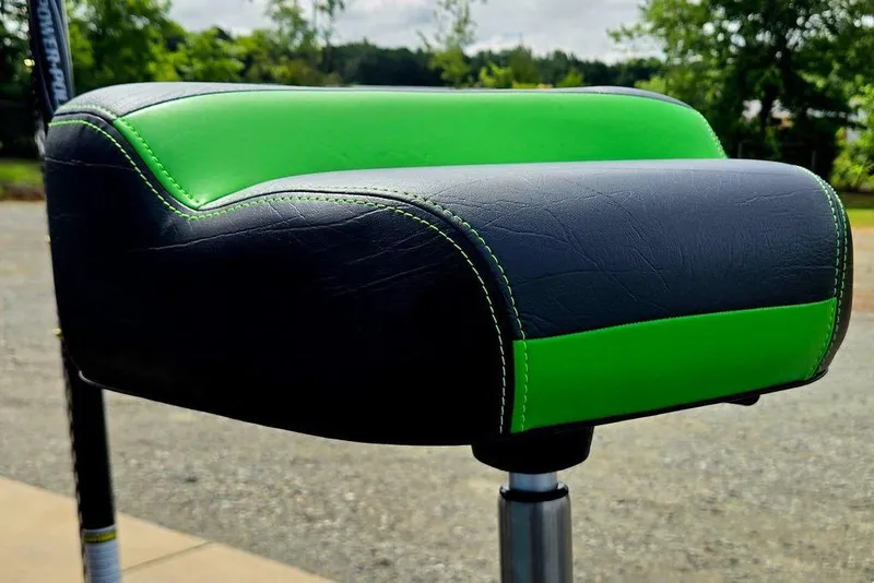 Slide: The Image of Green and black seat of 2027 Phoenix 721 ZXL boat, outdoors. - 62