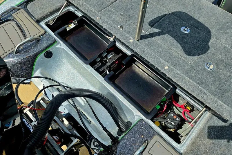 Slide: The Image of Interior view of a 2027 Phoenix 721 ZXL boat, showcasing battery compartments and wiring. - 61