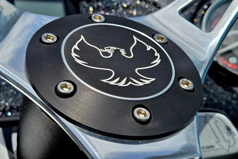 Slide: The Image of Close-up of 2027 Phoenix 721 ZXL emblem with stylized bird design. - 50