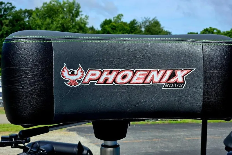 Slide: The Image of Phoenix 721 ZXL 2027 boat seat with logo, featuring green stitching. - 20