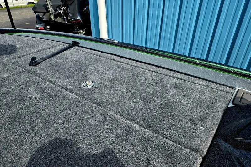 Slide: The Image of Carpeted deck of 2027 Phoenix 721 ZXL boat near blue wall. - 70
