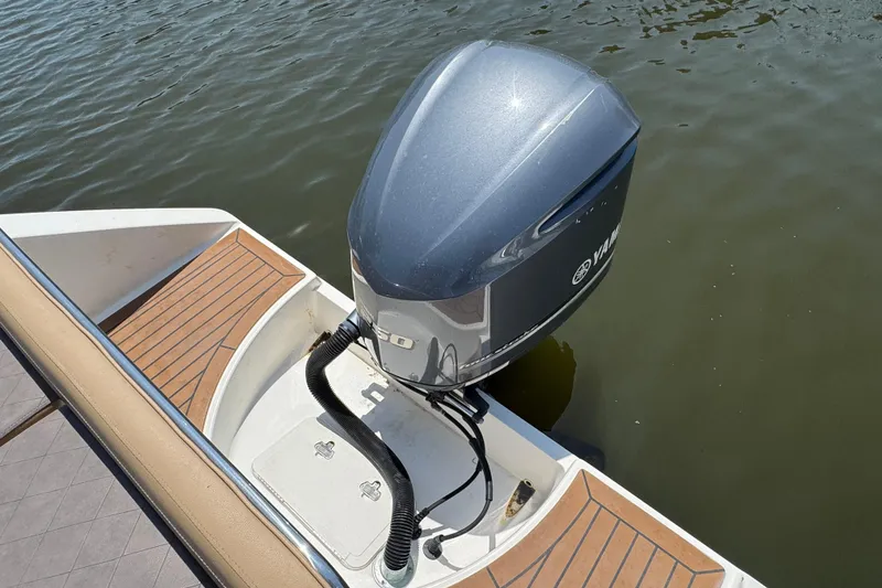 Slide: The Image of Century 2301 Center Console 2014 boat with Yamaha outboard motor on calm water. - 3