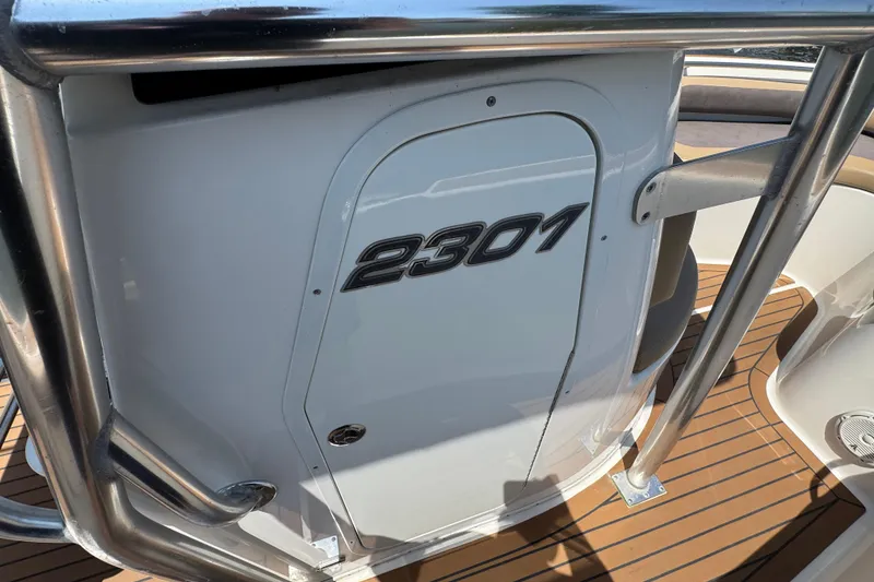 Slide: The Image of 2014 Century 2301 Center Console boat with sleek design and stainless steel railing. - 12