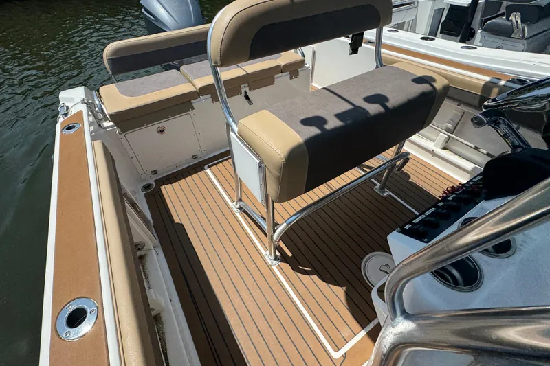 Slide: The Image of 2014 Century 2301 Center Console boat interior with seating and deck details. - 24
