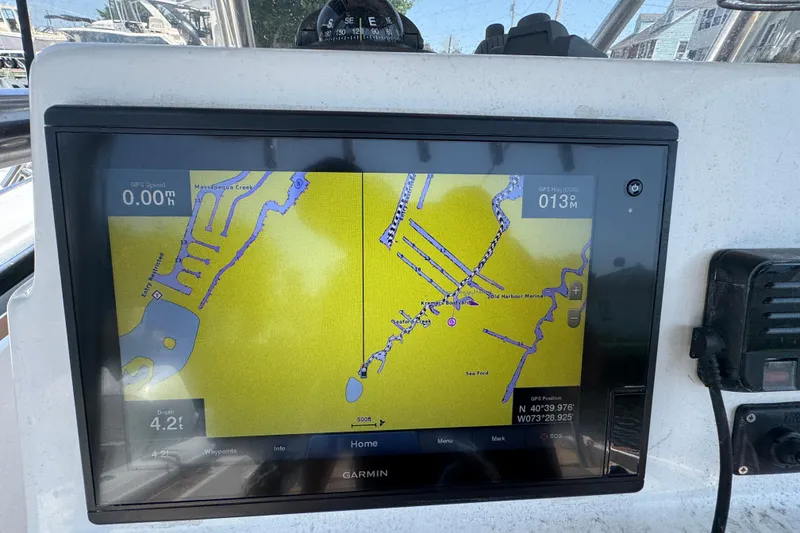 Slide: The Image of Garmin GPS display on 2014 Century 2301 Center Console boat, showing navigation map. - 13