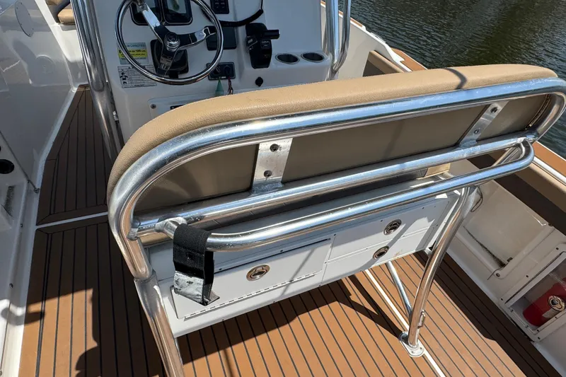 Slide: The Image of 2014 Century 2301 Center Console boat interior with steering wheel and seating. - 9