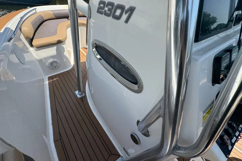 Slide: The Image of 2014 Century 2301 Center Console boat interior with seating and stainless steel details. - 18