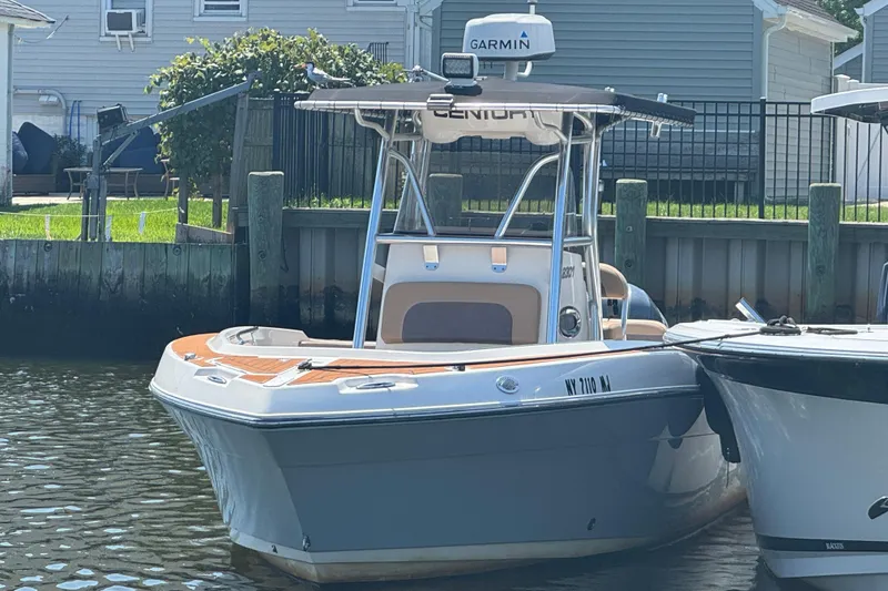 The Image of 2014 Century 2301 Center Console boat docked with Garmin equipment. - 0
