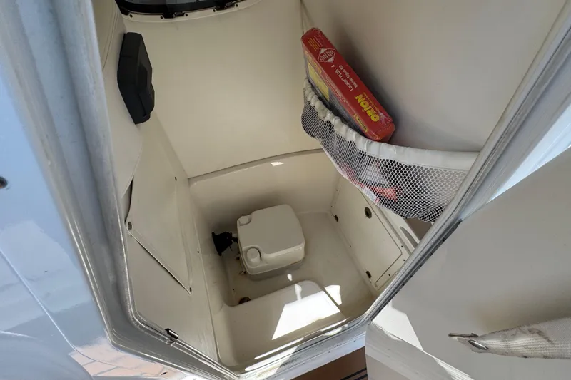 Slide: The Image of Interior of a 2014 Century 2301 Center Console boat with storage and toilet. - 11