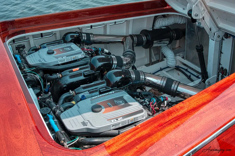 Slide: The Image of Engine compartment of a 2020 Custom Windlea Runabout boat, featuring dual inboard engines. - 21