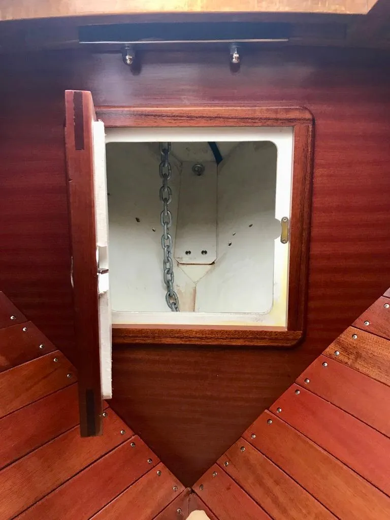 Slide: The Image of 2020 Custom Windlea Runabout anchor locker with wooden finish and chain storage. - 9