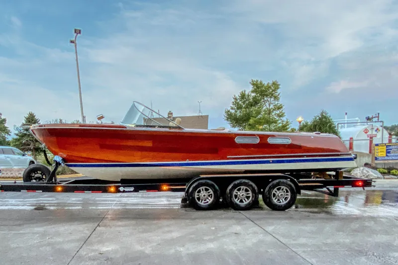Slide: The Image of Custom 2020 Windlea 28 Runabout boat on trailer, showcasing sleek design and vibrant colors. - 23