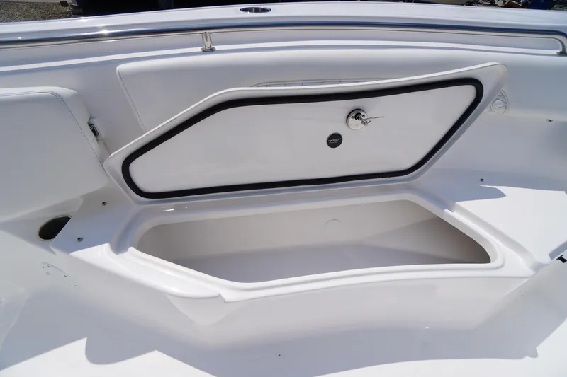 Slide: The Image of 2026 Tidewater 232 CC Adventure boat storage compartment, open and empty. - 17