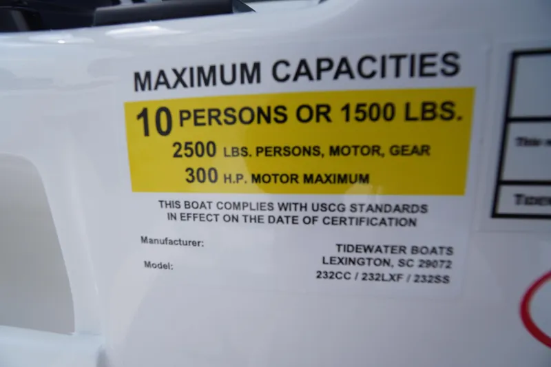 Slide: The Image of 2026 Tidewater 232 CC Adventure boat capacity label, 10 persons or 1500 lbs, 300 HP max. - 42