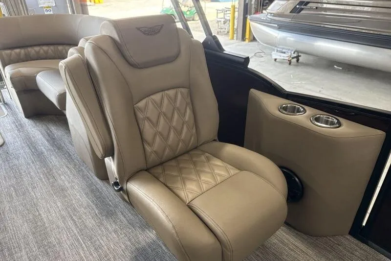 Slide: The Image of Luxurious seating in the 2026 Bennington 24 LXS Quadbench pontoon boat interior. - 11