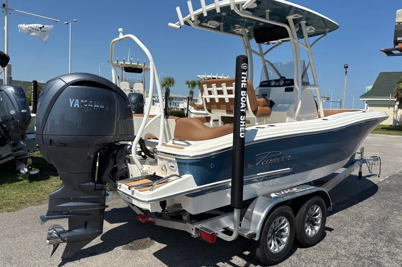 Slide: The Image of 2027 Pioneer 202 Islander boat with Yamaha engine on trailer, displayed outdoors. - 3